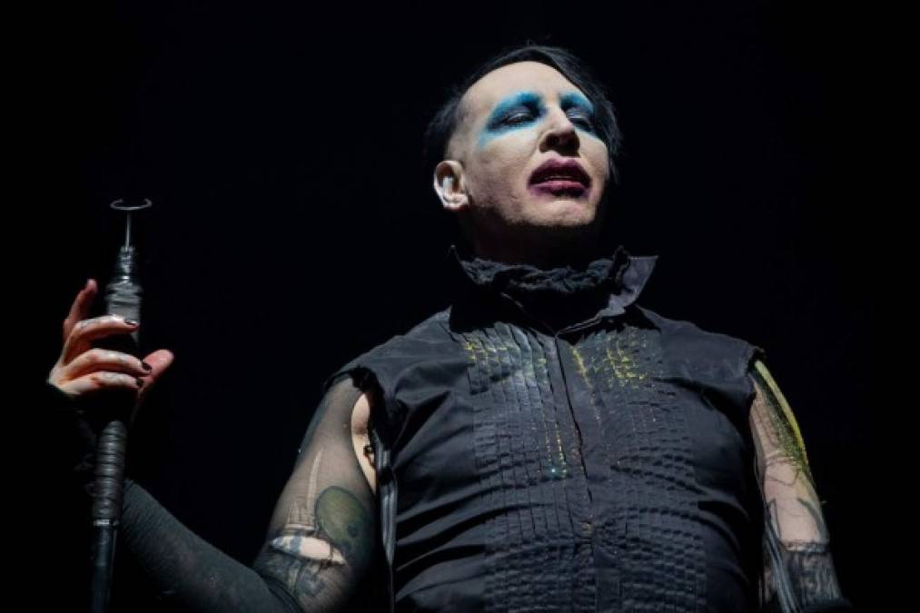 (FILES) In this file photo Marilyn Manson performs during the Astroworld Festival at NRG Stadium on November 9, 2019 in Houston, Texas - 'Westworld' star Evan Rachel Wood on February 1, 2021 accused industrial rock icon Marilyn Manson of being a 'dangerous man' who subjected her to years of abuse starting when she was a teenager. The American actress, who began working in entertainment as a child, has in the past alleged abuse by an ex-partner whom she kept anonymous, but on Monday identified her abuser as 'Brian Warner, also known to the world as Marilyn Manson.' (Photo by SUZANNE CORDEIRO / AFP)