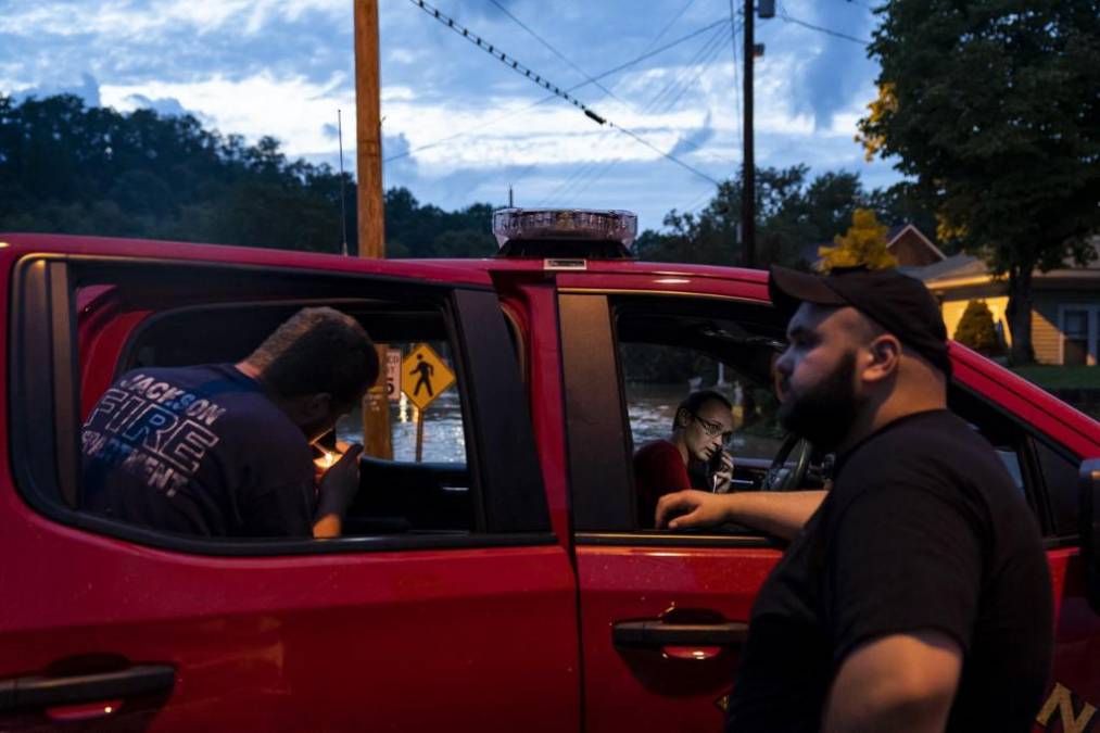 JACKSON, KY - JULY 28: Members of the Jackson Fire Department take a break outside their vehicle downtown on July 28, 2022 in Jackson, Kentucky. Storms that dropped as much as 12 inches of rain in some parts of Eastern Kentucky have caused devastating floods in some areas and have claimed at least eight lives. Michael Swensen/Getty Images/AFP (Photo by Michael Swensen / GETTY IMAGES NORTH AMERICA / Getty Images via AFP)