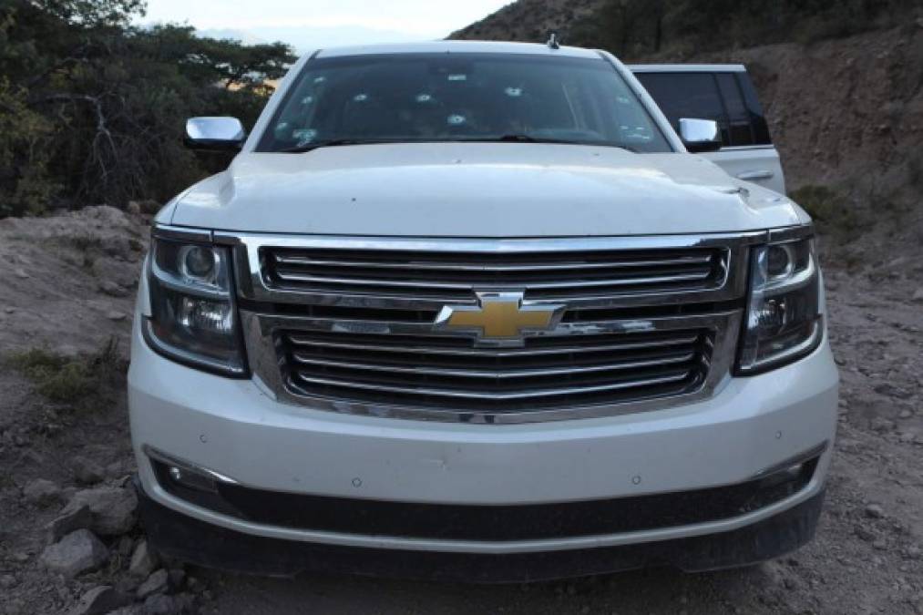 CORRECTION - View of the car where part of the nine murdered members of the Lebaron family were killed during an gunmen ambush on Bavispe, Sonora mountains, Mexico, on November 5, 2019. - US President Donald Trump offered Tuesday to help Mexico 'wage war' on its cartels after three women and six children from an American Mormon community were murdered in an area notorious for drug traffickers. (Photo by Herika MARTINEZ / AFP) / The erroneous mention[s] appearing in the metadata of this photo by Herika MARTINEZ has been modified in AFP systems in the following manner: [AFP PHOTO / Herika MARTINEZ ] instead of [AFP PHOTO / STR ]. Please immediately remove the erroneous mention[s] from all your online services and delete it (them) from your servers. If you have been authorized by AFP to distribute it (them) to third parties, please ensure that the same actions are carried out by them. Failure to promptly comply with these instructions will entail liability on your part for any continued or post notification usage. Therefore we thank you very much for all your attention and prompt action. We are sorry for the inconvenience this notification may cause and remain at your disposal for any further information you may require.