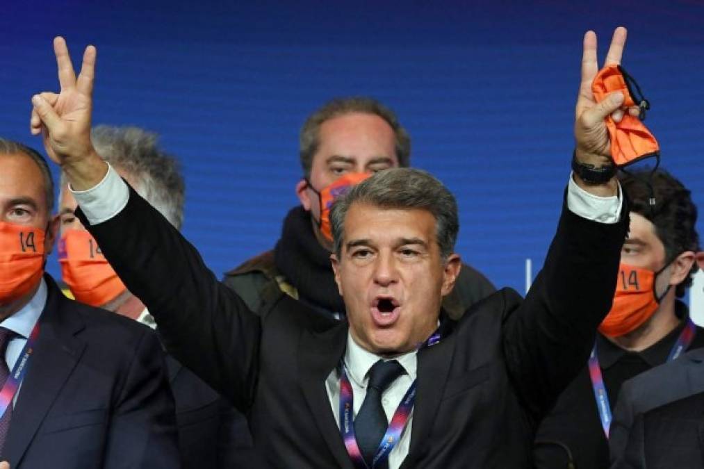 Spanish lawyer Joan Laporta celebrates his victory at the auditorium of the Camp Nou complex after winning the election for the FC Barcelona presidency on March 7, 2021 in Barcelona. - Joan Laporta, 58, returned as Barcelona president today after winning the club's elections by a clear margin, with his central pledge to try to persuade Lionel Messi to stay. Laporta was last president at Barca between 2003 and 2010, which included overseeing the hugely successful appointment of Pep Guardiola as coach and the iconic treble-winning team of 2008-9. (Photo by LLUIS GENE / AFP)