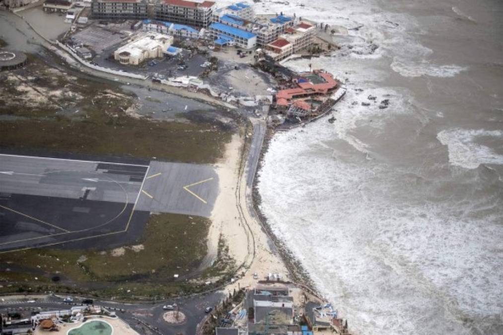 An aerial photography taken and released by the Dutch department of Defense on September 6, 2017 shows the damage of Hurricane Irma on Maho beach, on the Dutch Caribbean island of Sint Maarten.<br/>Hurricane Irma, rampaging across the Caribbean, has produced sustained winds at 295 kilometres per hour (183 miles per hour) for more than 33 hours, making it the longest-lasting, top-intensity cyclone ever recorded, France's weather service said on September 7. / AFP PHOTO / DUTCH DEFENSE MINISTRY / GERBEN VAN ES / Netherlands OUT / RESTRICTED TO EDITORIAL USE - MANDATORY CREDIT 'AFP PHOTO / DUTCH DEFENSE MINISTRY/GERBEN VAN ES' - NO MARKETING NO ADVERTISING CAMPAIGNS - DISTRIBUTED AS A SERVICE TO CLIENTS<br/><br/>