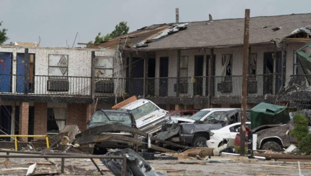 EL RENO, OK - MAY 26: Guests' cars sit mangled outside the American Budget Value Inn May 26, 2019 in El Reno, Oklahoma. At least two people were killed in this Oklahoma City suburb after a tornado barreled through, destroying much of the motel, a trailer park and a car dealership last night, according to published reports. J Pat Carter/Getty Images/AFP<br/><br/>== FOR NEWSPAPERS, INTERNET, TELCOS & TELEVISION USE ONLY ==<br/><br/>