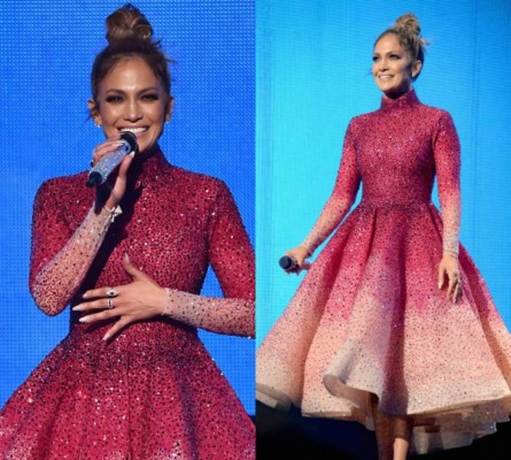 Este, sin duda, fue el 'look' estrella de la noche de Jennifer Lopez. De corte 'lady', con un gran vuelo y un 'degradé' en tonos fucsias y rosados, de Michael Cinco.