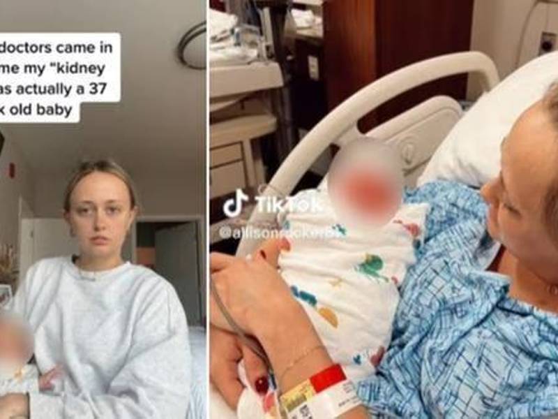 La mujer en el hospital con su bebé en los brazos.