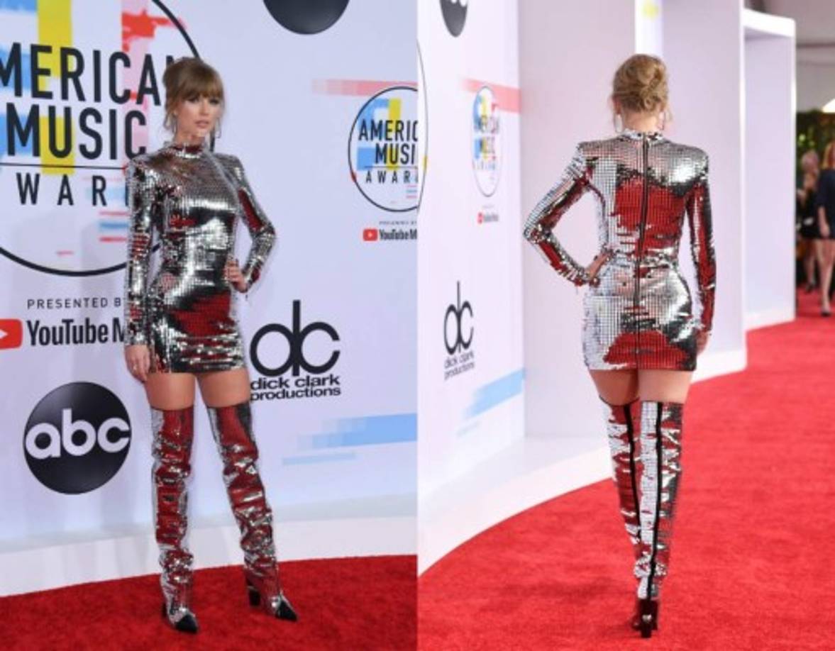 Taylor Swift<br/><br/>La reina de la noche deslumbró con su minivestido plateado que acompañó con unas botas altas del mismo material. Solo una diva como ella podría usar un atuendo así y lucir glamourosa.<br/><br/><br/>