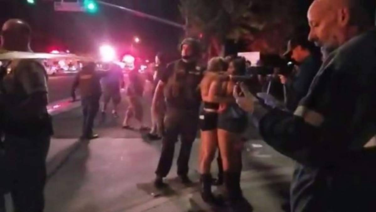 This handout video grab obtained on November 8, 2018 courtesy of Jeremy Childs twitter account shows people gathering outside a country music bar and dance hall in Thousand Oaks, in the Los Angeles-area, after a gunman barged into a large, crowded venue and opened fire late November 7, wounding at least 11 people including a police officer, US police said. - The venue in a quiet, upscale residential suburb was hosting an event for college students, with possibly several hundred young people in attendance, Captain Garo Kuredjian of the Ventura County Sheriff's office said. (Photo by Jeremy CHILDS / USA Today / AFP) / RESTRICTED TO EDITORIAL USE - MANDATORY CREDIT 'AFP PHOTO / USA TODAY / JEREMY CHILDS TWITTER ACCOUNT' - NO MARKETING NO ADVERTISING CAMPAIGNS - DISTRIBUTED AS A SERVICE TO CLIENTS - NO ARCHIVE