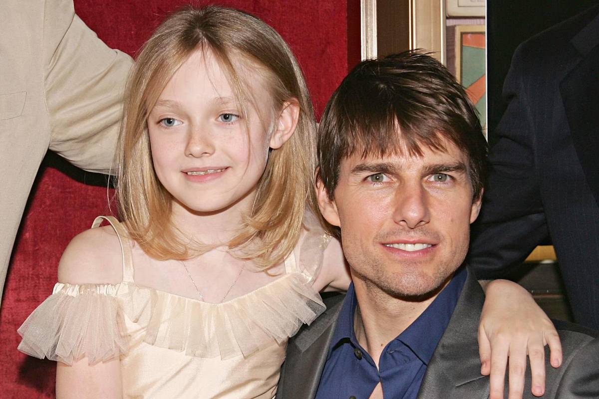 Dakota Fanning y Tom Cruise en una foto de archivo del año 2005, cuando ambos promocionaban el filme “La Guerra de los Mundos”.