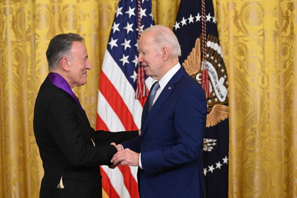 US President Joe Biden awards musician Bruce Springsteen with the 2021 National Medal of Arts during a ceremony in the East Room of the White House in Washington, DC, March 21, 2023. (Photo by SAUL LOEB / AFP)