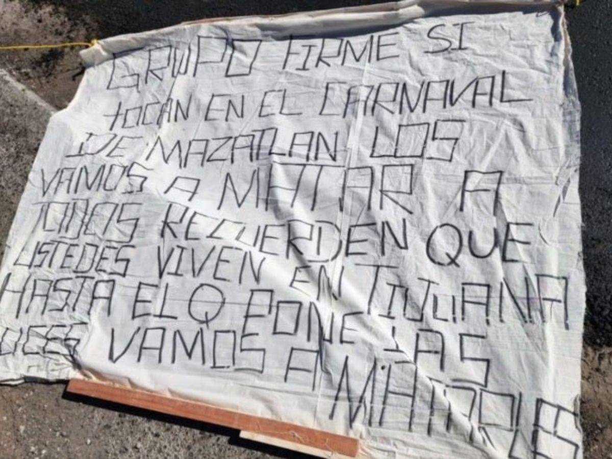 Grupo Firme es amenazado a muerte con narcomanta y restos humanos