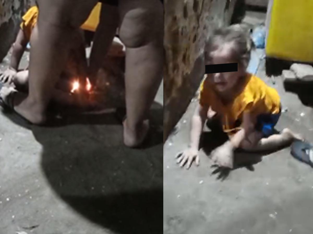 Imagen del video cuando la madre intenta quemar a su hija de tres años.