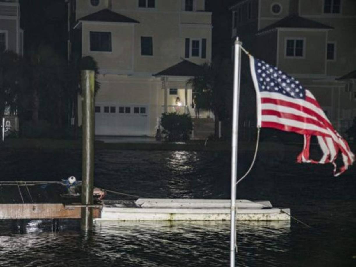 This aerial view shows homes damaged by Hurricane Laura on August 27, 2020, in Grand Lake, Louisiana. - Hurricane Laura slammed into the southern US state of Louisiana Thursday and the monster category 4 storm prompted warnings of 'unsurvivable' ocean surges and evacuation orders for hundreds of thousands of Gulf Coast residents. The National Hurricane Center (NHC) said 'extremely dangerous' Laura would bring winds of 150 miles per hour (240 kilometers per hour) and 'destructive waves will cause catastrophic damage' to Louisiana and Texas. (Photo by STRINGER / AFP)
