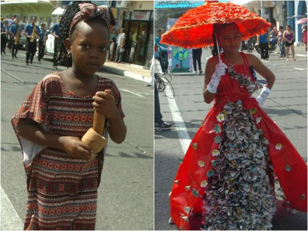 Una hermosa pequeña hace honor a la etnia garífuna y la otra luce un vestido con materiales reciclados en La Ceiba.