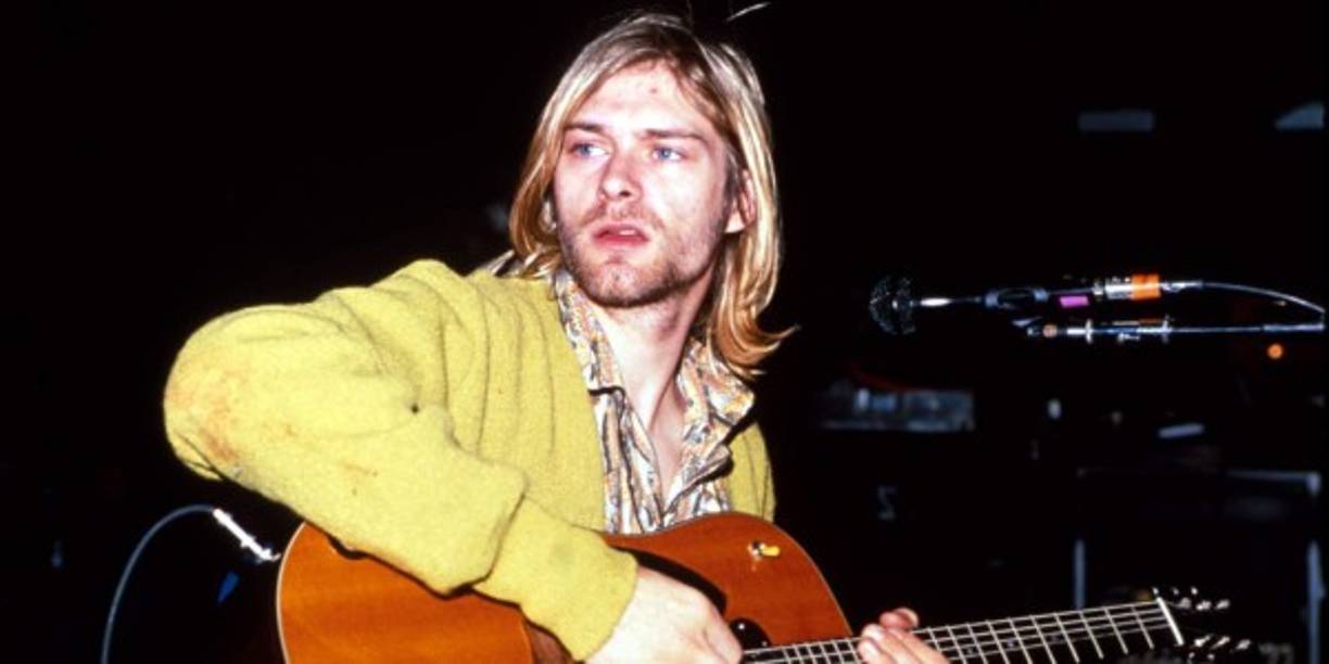 Kurt Cobain: Kurt Donald Cobain, nacido en febrero de 1967 en Aberdeen, Estados Unidos, ha sido sindicado por la crítica como el último “portavoz de una generación” que tuvo la música popular. <br/><br/>Después de que el grupo tocara su ultimo concierto en Alemania, al cantante se le diagnosticó bronquitis y laringitis severas, por lo que viajó a Roma para recibir tratamiento médico. A la mañana siguiente, cuando despertó, su esposa, Courtney Love, descubrió que Cobain había sufrido una sobredosis por una combinación de champán y flunitrazepam, que ella calificó de intento de suicidio. Después de cinco días de tratamiento, Cobain salió del hospital y regresó a Seattle. Su estado mental, por cierto, no era el mejor. De hecho, sus recurrentes ataques de depresión lo habían llevado a querer titular el último disco de Nirvana como “I hate myself and I want to die” (“Me odio a mí mismo y quiero morir”).<br/><br/>Pero pese a la fama planetaria y el dinero que le llegaba a raudales, también se sentía incómodo y frustrado, creyendo que su mensaje y su visión artística habían sido malinterpretadas por el público. Además, su notoria incapacidad para hacer frente a las presiones profesionales y personales de su vida, lo fueron convirtiendo en un adicto a la heroína y los tranquilizantes.<br/>