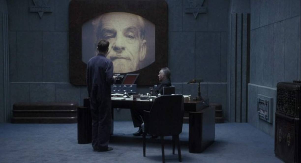 Smith y la mujer son descubiertos. Posteriormente, ambos son sometidos a una serie de mecanismos opresores donde el pasado, el presente y el futuro no existen. 2 más 2 es igual a 5, y es verdadero. Tras largos castigos, Smith termina por aceptar la verdad que el Gran Hermano impone, aún a costa de su propia dignidad.