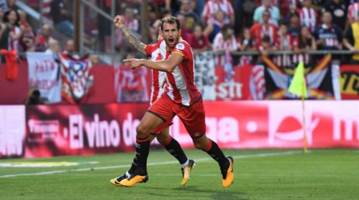 Barcelona's Argentinian forward Lionel Messi celebrates after scoring a goal during the Spanish league football match between Girona FC and FC Barcelona at the Montilivi stadium in Girona on January 27, 2019. (Photo by LLUIS GENE / AFP)