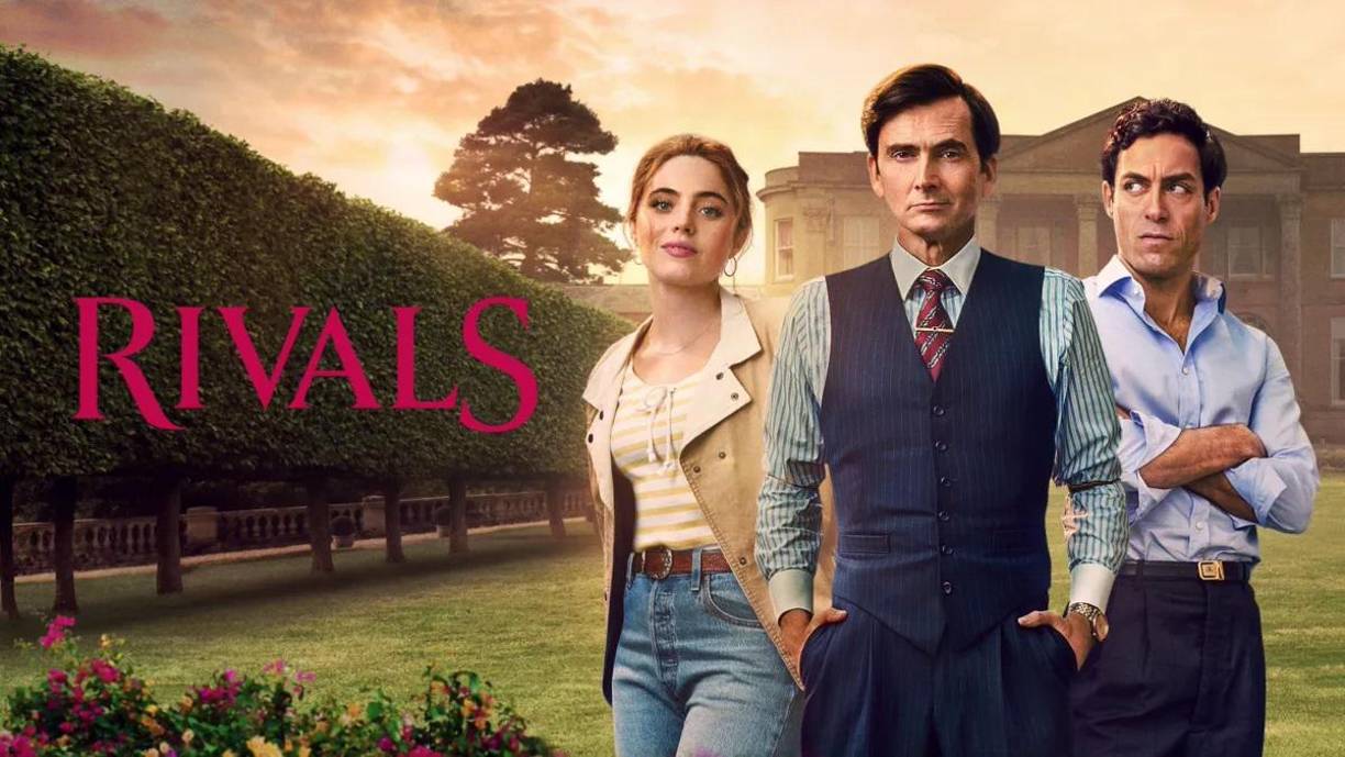  Rivales (Rivals) en Disney+. Está basada en la novela de Jilly Cooper, esta serie dramática explora las rivalidades y romances en el mundo de la televisión británica.