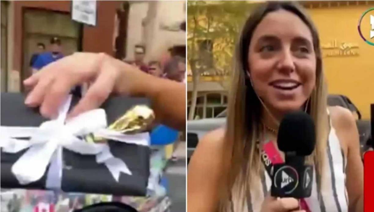 Ya adentro del Lamborghini, la periodista encontró en un compartimiento un paquete lujoso con una figura de la copa del mundo.