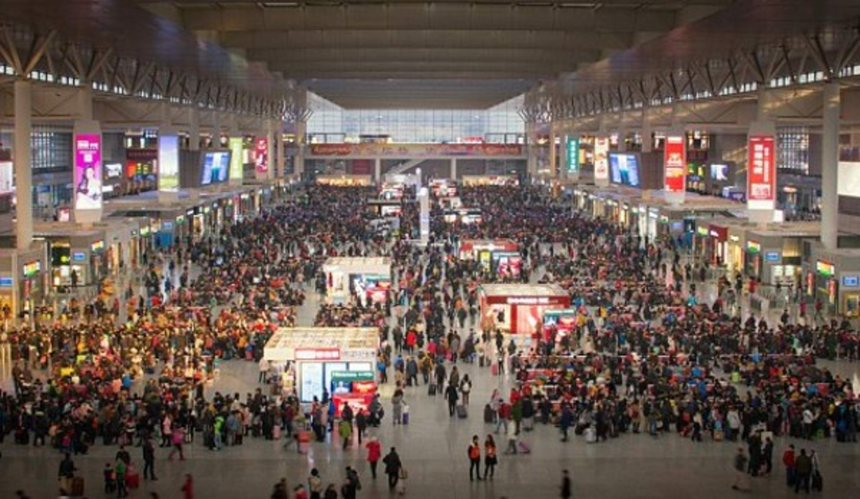 Oslaydis Viquillon, center, originally from Cuba, wipes tears from her eyes as she and her fellow new citizens sing 'America the Beautiful' after their naturalization ceremony in Miami, FL on Friday, November 18, 2016. 170 people from 27 different countries became United States citizens during the ceremony. <br/>By Scott McIntyre for The Atlantic