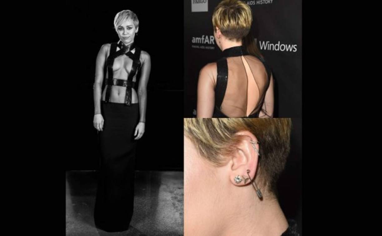 La cantante se decidió por este arriesgado vestido compuesto por un top transparente de manga larga decorado con tiras de cuero de inspiración bondage y falda recta de la colección de primavera 2015 de Tom Ford.