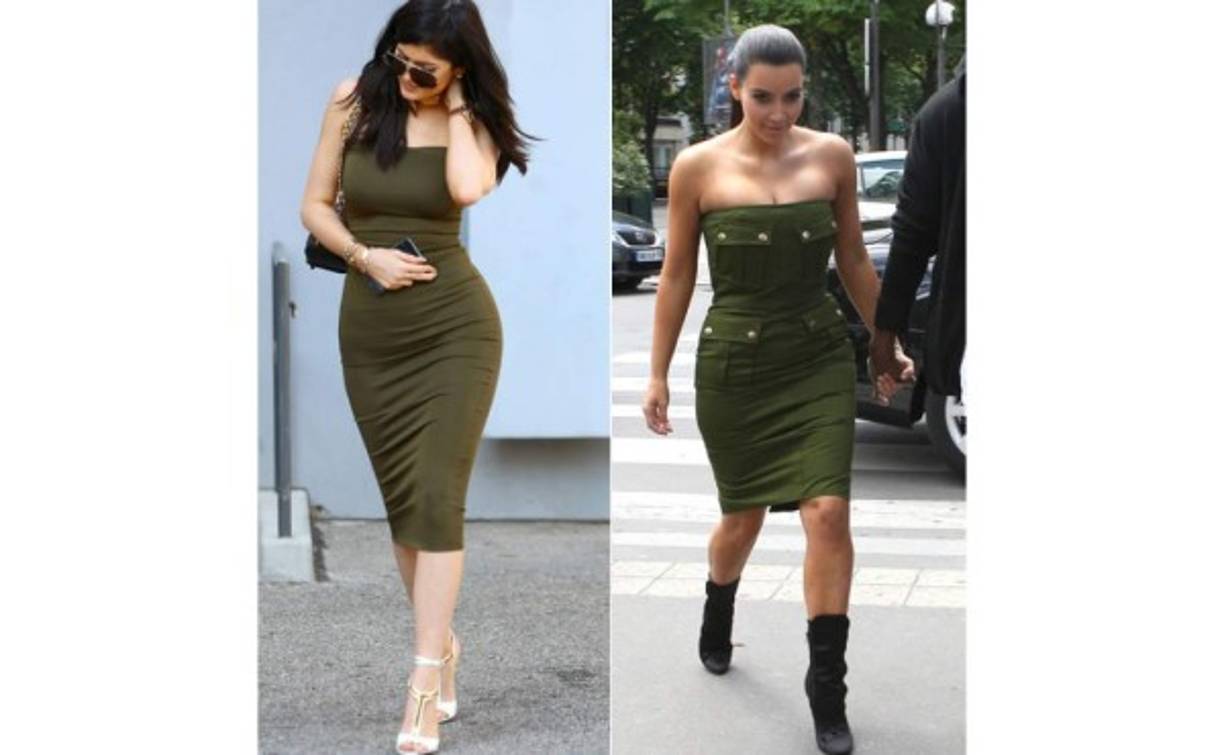 Kylie vs Kim en un vestido verde militar con strapless y bajo la rodilla.