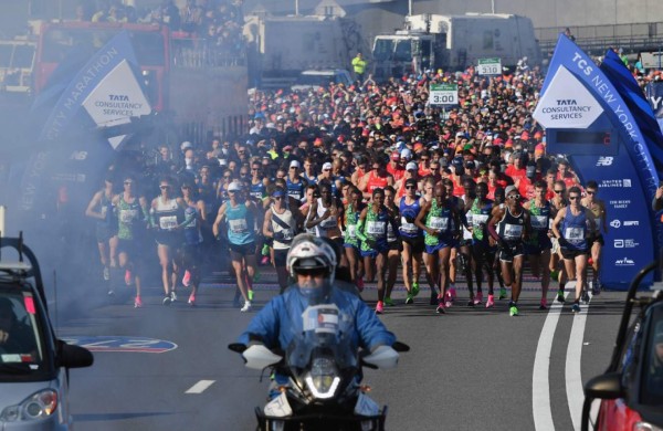 NEW YORK, NY - MARCH 15 : People take a photo in an empty Rockefeller Plaza on March 15, 2020 in New York City. The World Health Organization declared COVID-19 a global pandemic on March 11. Stephanie Keith/Getty Images/AFP