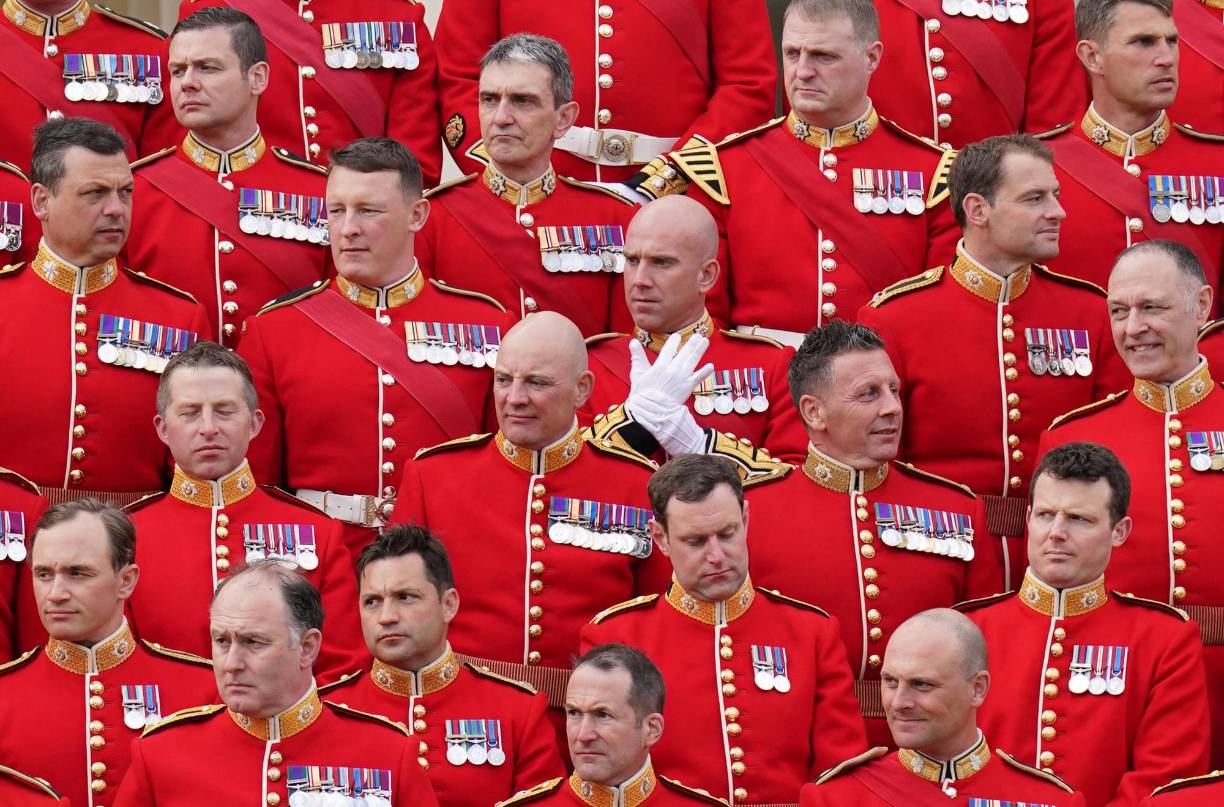 Household Division Officers and Senior Non-Commissioned Officers, who will be taking part in the May 6 Coronation of King Charles III, prepare to pose for a group photograph, during a visit by Britain's Princess Anne, Princess Royal, to at Wellington Barracks in central London on May 3, 2023. (Photo by Jonathan Brady / POOL / AFP)