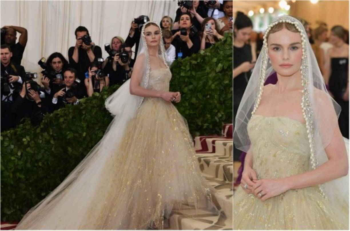 Kate Bosworth lució virginal con un diseño de Oscar de la Renta con escote palabra de honor y gran cola, que la actriz complementó con un velo realmente sobrio. Espectacular.