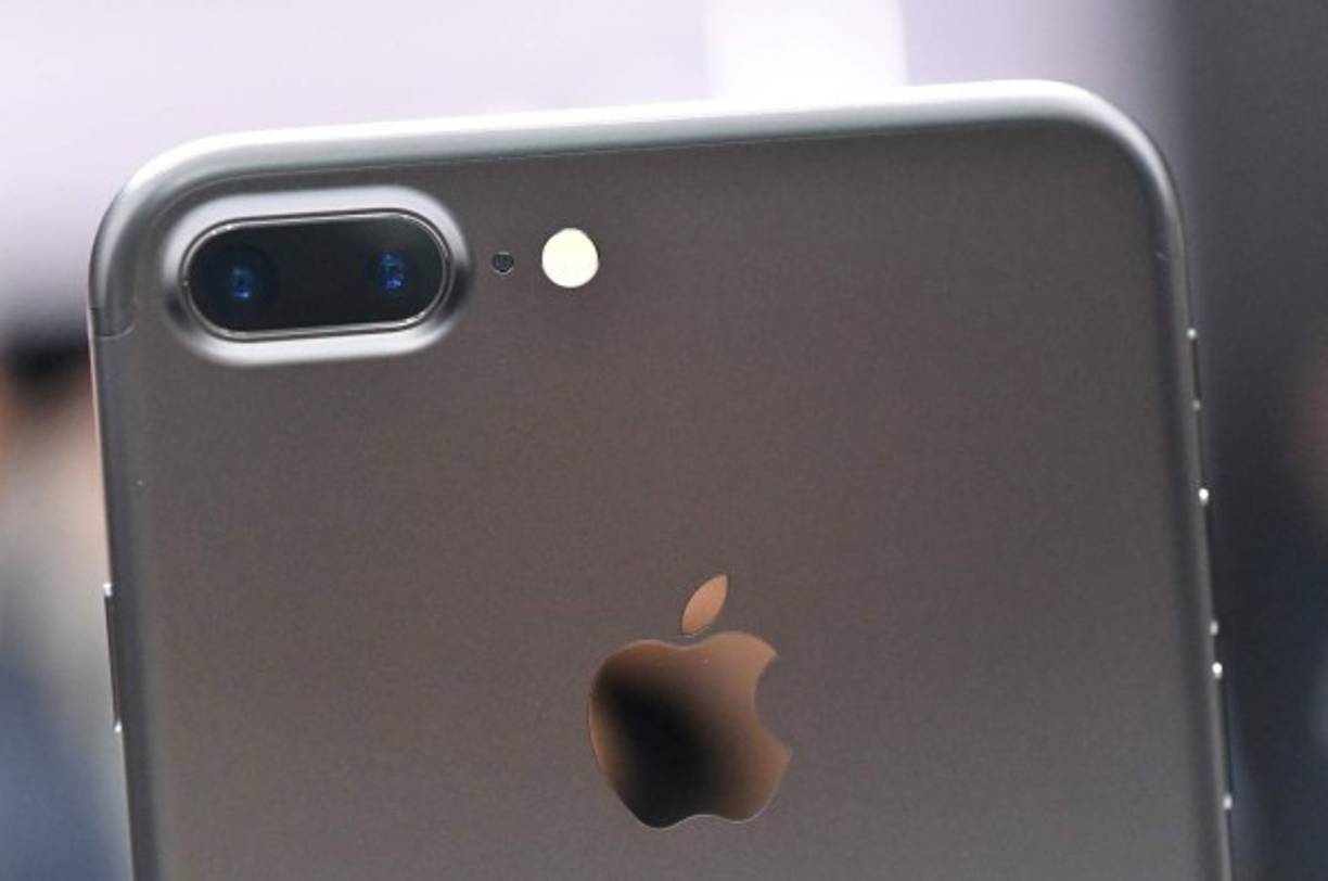 A closeup view of the iPhone 7 Plus' dual cameras during an Apple media event at Bill Graham Civic Auditorium in San Francisco, California on September 7, 2016. <br/>Apple on Wednesday unveiled two upgraded versions of its iPhone and a new waterproof smartwatch, seeking to reignite growth for the iconic technology maker. The iPhone 7 and larger iPhone 7 Plus, with new camera technology, 50-meter water resistance and other features, were the highlight of an Apple media event in San Francisco.<br/> / AFP PHOTO / Josh Edelson