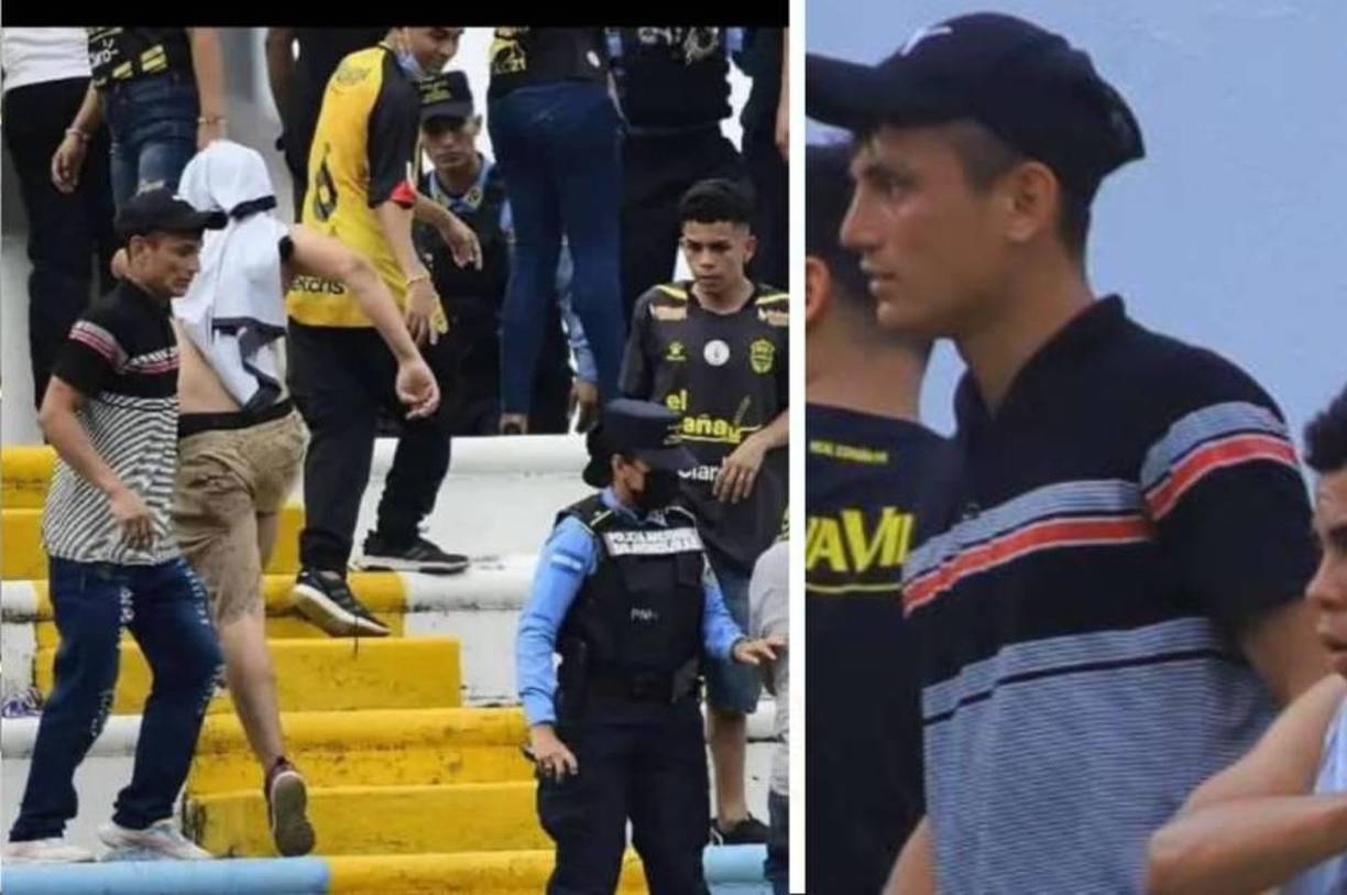 El Motagua resultó ganador, lo que provocó que algunos aficionados del equipo rival comenzaran a invadir la grama y a causar disturbios en las graderías. Uno de ellos fue el joven Wilson Pérez, quien aparece en esta imagen usando un pantalón jeans y una camiseta gris con líneas negras y rojas, a unos cuantos metros de dos agentes policiales que dialogan con otro ciudadano.