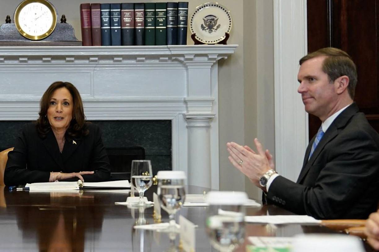 (FILES) Kentucky Governor Andy Beshear (R) looks on as US Vice President Kamala Harris speaks during a roundtable conversation about marijuana reform and criminal justice reform, in the Roosevelt Room of the White House on March 15, 2024 in Washington, DC. US President Joe Biden announced July 21, 2024 that he is dropping out of his reelection battle with Donald Trump, in a historic move that plunges the already turbulent 2024 White House race into uncharted territory. Biden's withdrawal from the race for the White House leaves a gap atop the Democratic presidential ticket that the party. (Photo by Kent Nishimura / AFP)