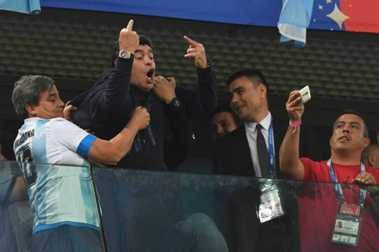 Retired Argentina player Diego Maradona (C) gestures during the Russia 2018 World Cup Group D football match between Nigeria and Argentina at the Saint Petersburg Stadium in Saint Petersburg on June 26, 2018.<br/><br/> / AFP PHOTO / OLGA MALTSEVA / RESTRICTED TO EDITORIAL USE - NO MOBILE PUSH ALERTS/DOWNLOADS