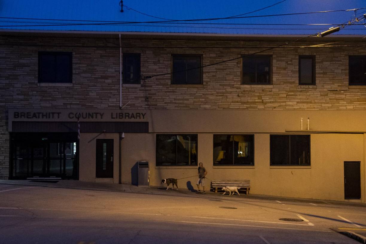 JACKSON, KY - JULY 30: A resident of Jackson walks his dogs through town on July 30, 2022 in Jackson, Kentucky. At least 20 people have been killed and hundreds had to be rescued amid flooding from heavy rainfall. Michael Swensen/Getty Images/AFP (Photo by Michael Swensen / GETTY IMAGES NORTH AMERICA / Getty Images via AFP)
