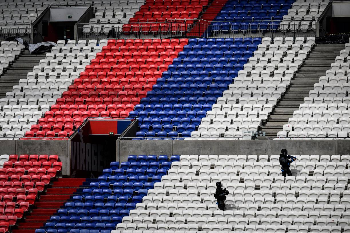 Police officers, military personnel, rescue workers and firefighters take part in an exercise simulating a terrorist attack on April 5, 2024 at the Groupama Stadium in Decines-Charpieu, a few months before the opening of the Paris 2024 summer Olympic Games. (Photo by JEFF PACHOUD / AFP)