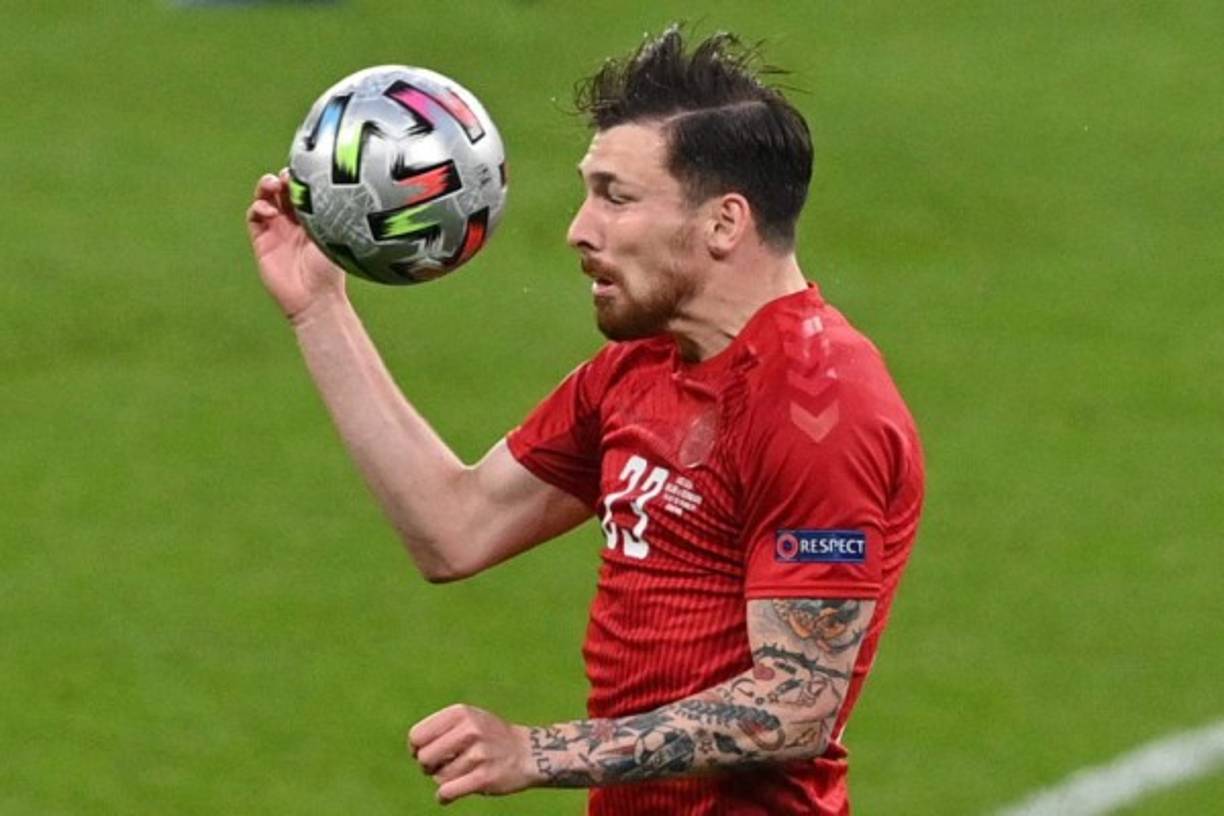 Denmark's midfielder Pierre Hojbjerg heads the ball during the UEFA EURO 2020 semi-final football match between England and Denmark at Wembley Stadium in London on July 7, 2021. (Photo by JUSTIN TALLIS / POOL / AFP)