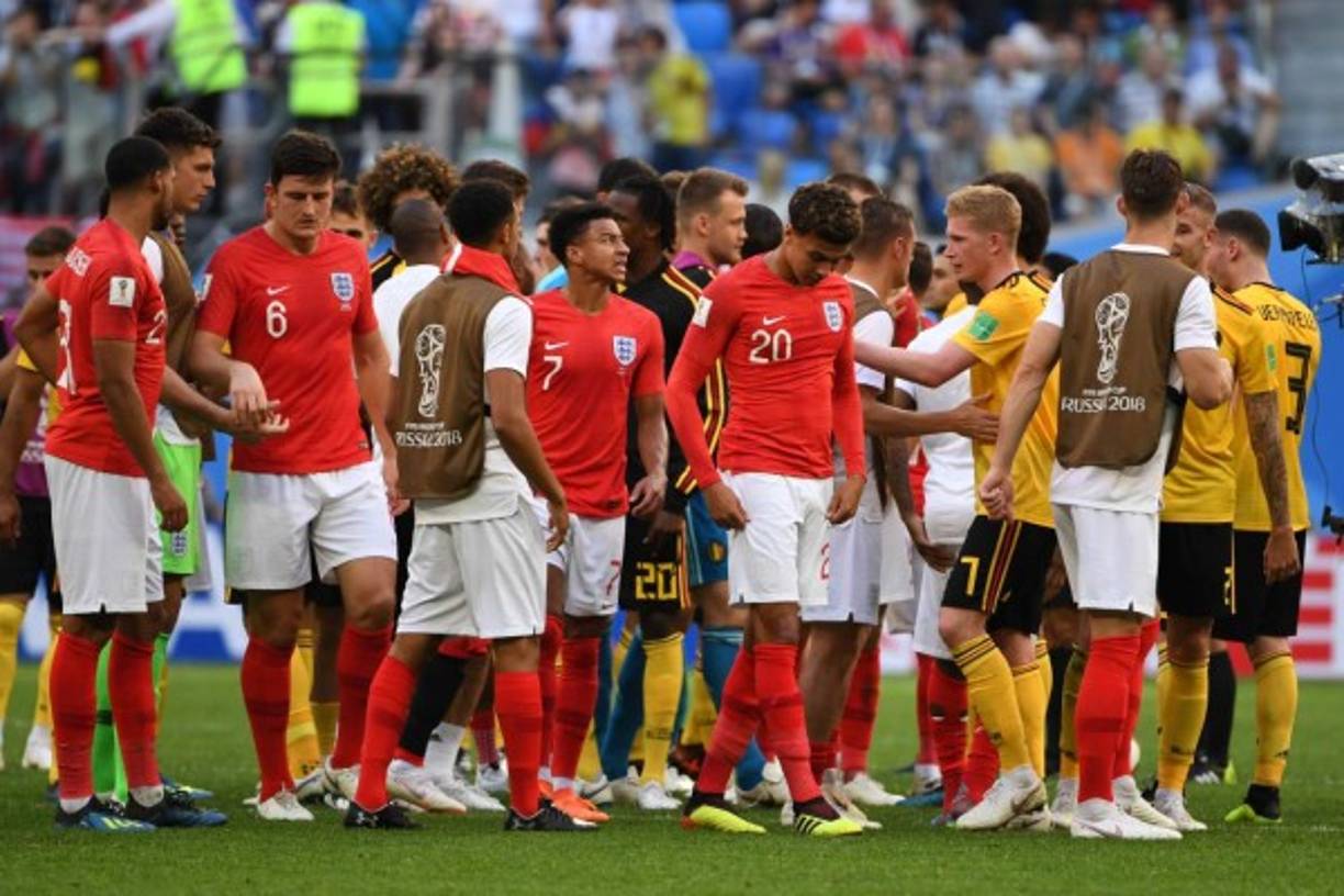 England (red) and Belgium players shake hands after their Russia 2018 World Cup play-off for third place football match between Belgium and England at the Saint Petersburg Stadium in Saint Petersburg on July 14, 2018. / AFP PHOTO / Paul ELLIS / RESTRICTED TO EDITORIAL USE - NO MOBILE PUSH ALERTS/DOWNLOADS<br/>
