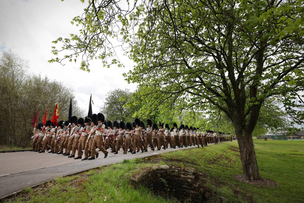 Guardsmen, officers and bands of the Household Division take part in a rehearsal for the upcoming coronation for Britain's King Charles III in Aldershot, south-west of London on April 28, 2023. - Over 700 soldiers marched from their barracks in Aldershot in the rehearsal to replicate the processional group that will accompany Their Majesties from Westminster Abbey to Buckingham Palace. (Photo by Adrian DENNIS / AFP)