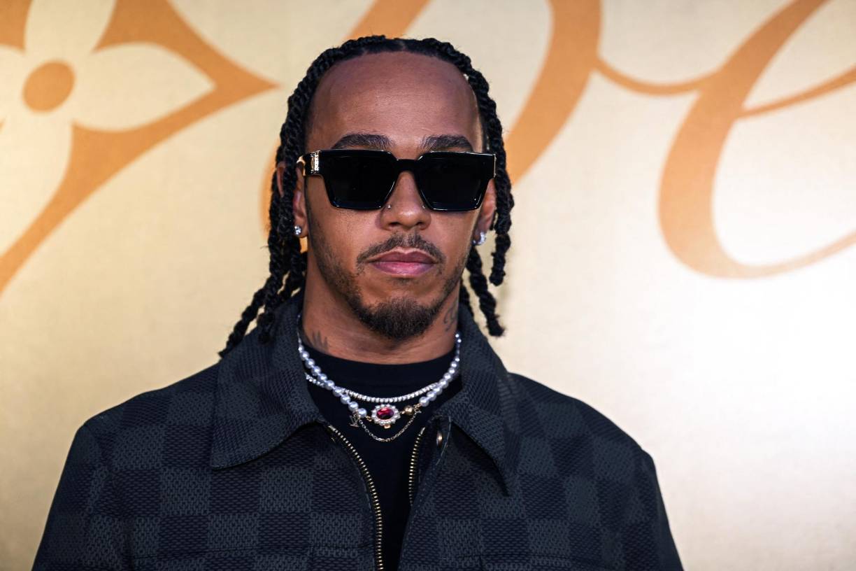 Formula One's British driver Lewis Hamilton poses for a photocall at the Louis Vuitton Menswear Spring-Summer 2024 show as part of the Paris Fashion Week, central Paris, on June 20, 2023. (Photo by STEFANO RELLANDINI / AFP)