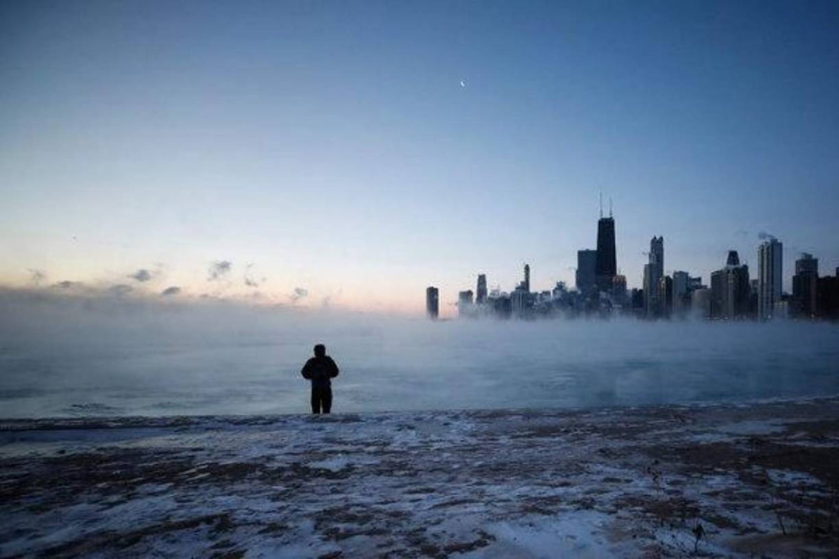 CHICAGO, ILLINOIS - AUGUST 10: Police officers detain a man who was found inside of a Best Buy store after parts of the city had widespread looting and vandalism, on August 10, 2020 in Chicago, Illinois. Police made several arrests during the night of unrest and recovered at least one firearm. Scott Olson/Getty Images/AFP<br/><br/>== FOR NEWSPAPERS, INTERNET, TELCOS & TELEVISION USE ONLY ==<br/><br/>