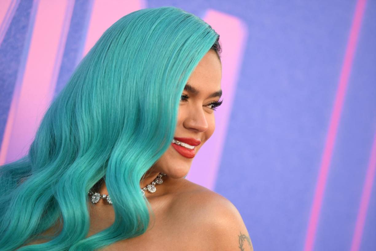 Colombian singer Karol G arrives for the 2022 Billboard Women in Music award at the YouTube theatre at SoFi stadium in Inglewood, California, March 2, 2022. (Photo by Robyn Beck / AFP)