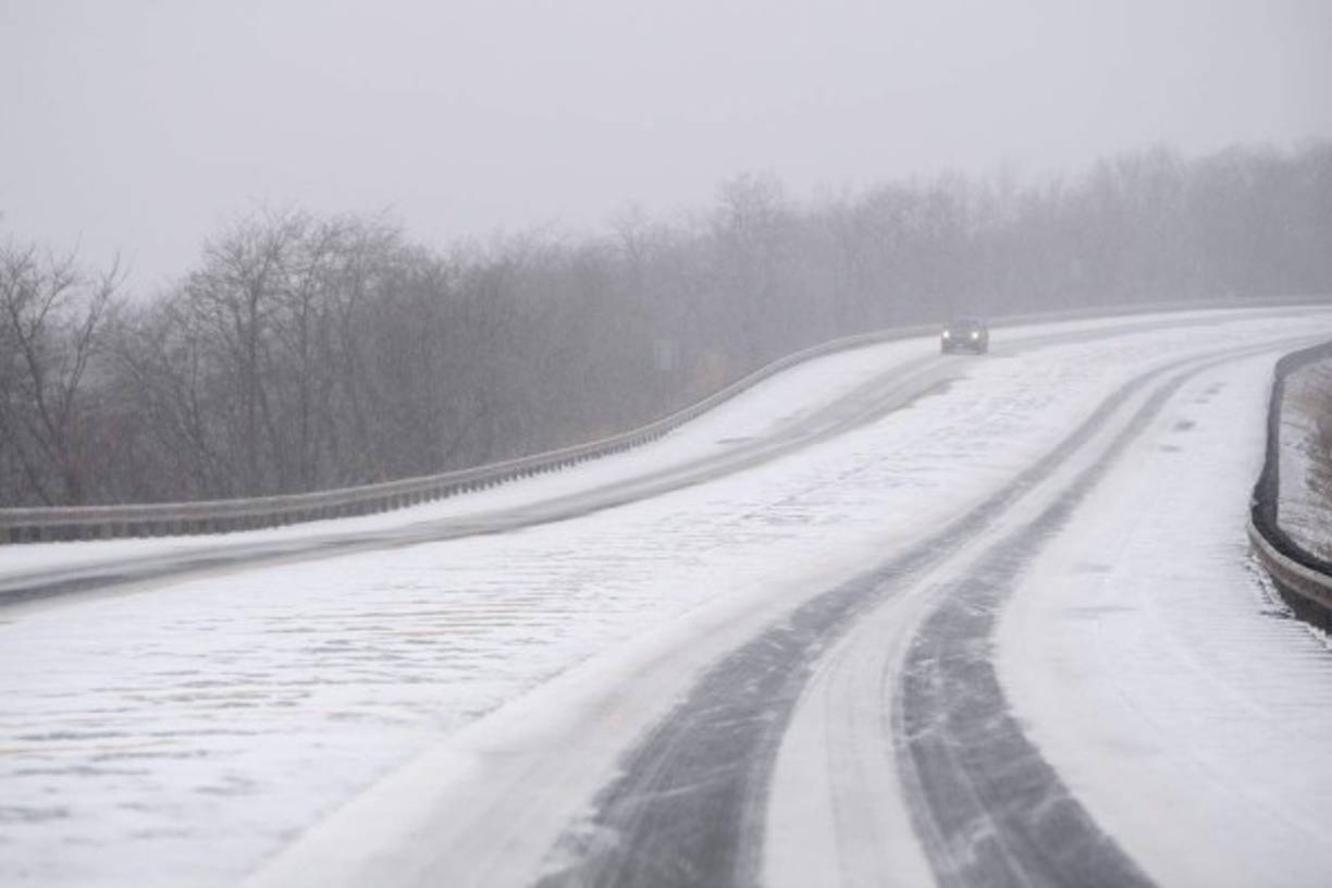 WILKES BARRE, PA - DECEMBER 16: A car navigates roads with accumulating snow on December 16, 2020 in Wilkes Barre, Pennsylvania. Winter storm Gail is expected to bring more than a foot of snow in parts of the Northeast. Mark Makela/Getty Images/AFP<br/><br/>== FOR NEWSPAPERS, INTERNET, TELCOS & TELEVISION USE ONLY ==<br/><br/>