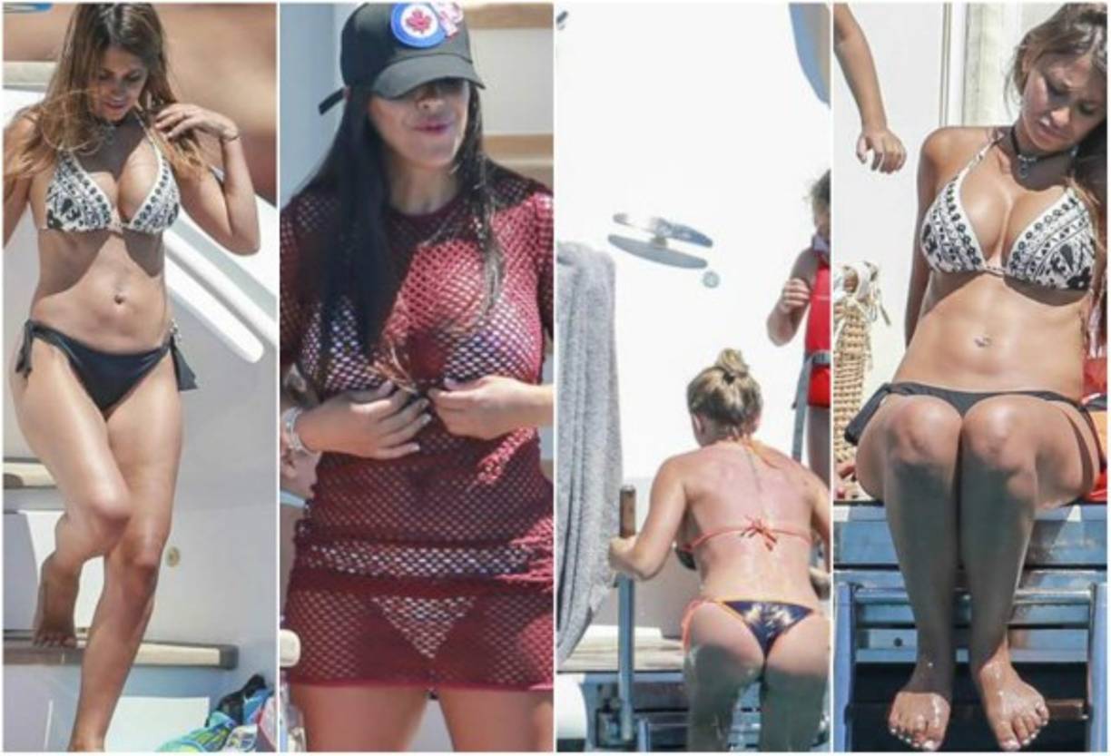 Argentina fans cheer with pictures of Argentina's forward Lionel Messi and Argentinian football legend Diego Maradona (R) ahead of a friendly football match between Spain and Argentina at the Wanda Metropolitano Stadium in Madrid on March 27, 2018. / AFP PHOTO / GABRIEL BOUYS