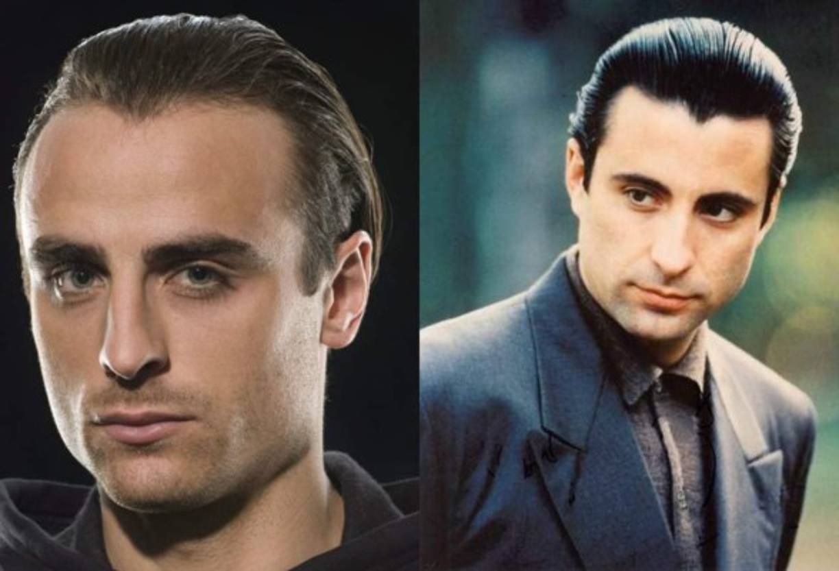 MANCHESTER, ENGLAND - APRIL 25: Cristiano Ronaldo (R) of Manchester United is congratulated by team mate Dimitar Berbatov after scoring his team's third goal during the Barclays Premier League match between Manchester United and Tottenham Hotspur at Old Trafford on April 25, 2009 in Manchester, England. (Photo by Shaun Botterill/Getty Images) *** Local Caption *** Cristiano Ronaldo;Dimitar Berbatov