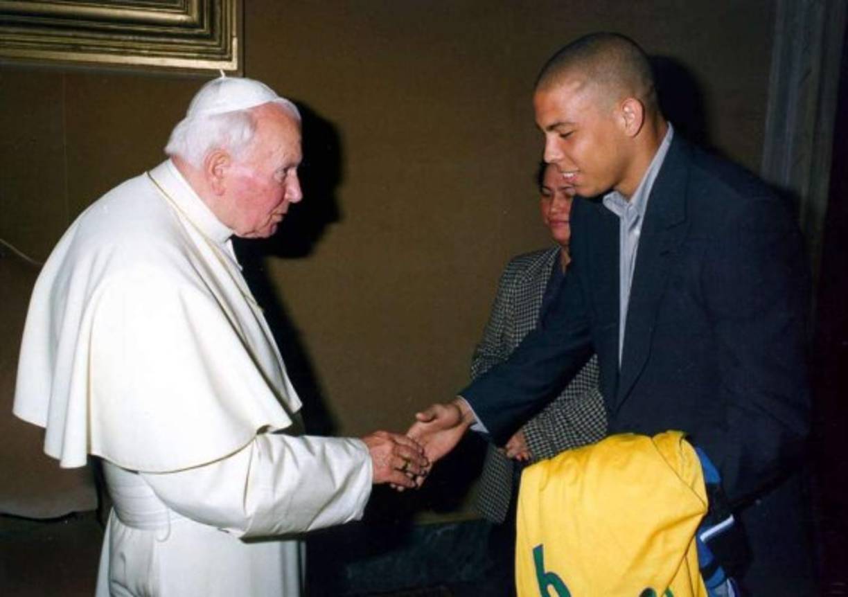 In this 2012 photo provided by a former member of the church, Word of Faith Fellowship leader Jane Whaley, center, holds a baby with others during a church ceremony in Spindale, N.C. From all over the world, they flocked to a tiny North Carolina town in the foothills of the Blue Ridge Mountains, lured by promises of inner peace and eternal life. What many found instead: years of terror _ waged in the name of the Lord. (AP Photo)