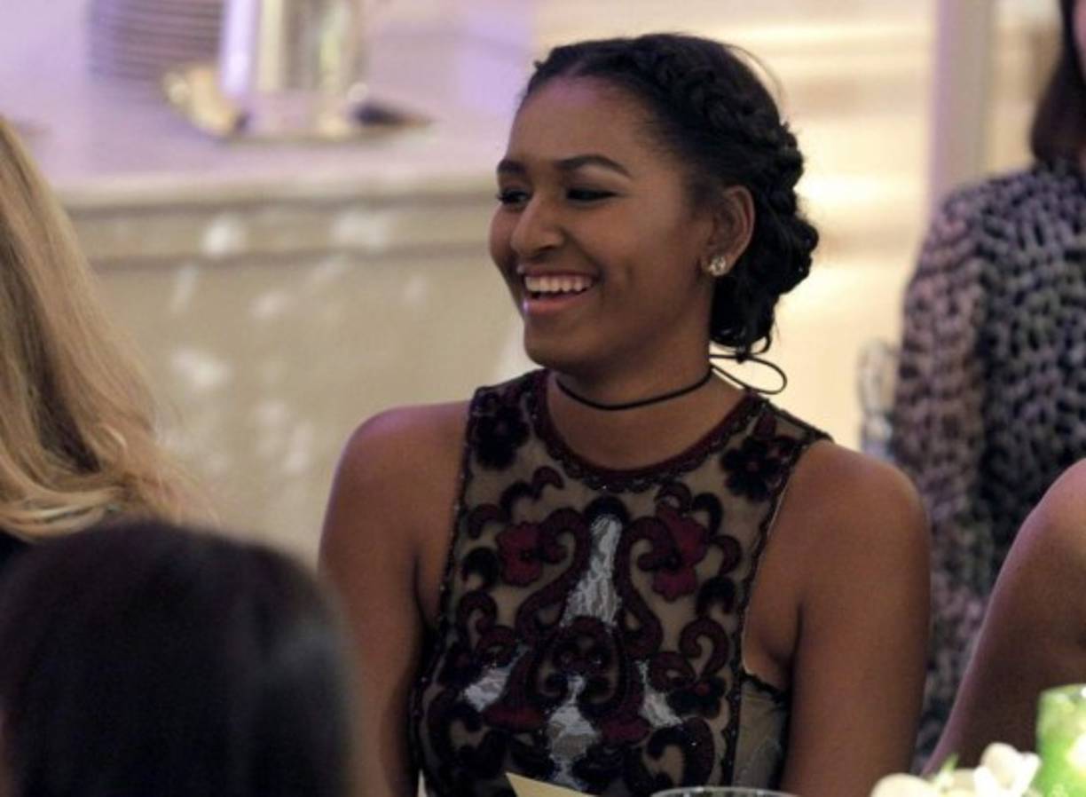 Photo © 2017 Instar Images/The Grosby Group<br/><br/>Miami, January 14, 2017.<br/>President Barack Obama's youngest daughter Sasha Obama soaks up the sun with Joe Biden's granddaughter Maisy Biden and friends on the beaches of Miami. Sasha looks trendy in a black bikini swimsuit top and patterned shorts as she strolls the beach with her friends.<br/>The sighting comes days after Sasha was absent from her father's farewell speech.