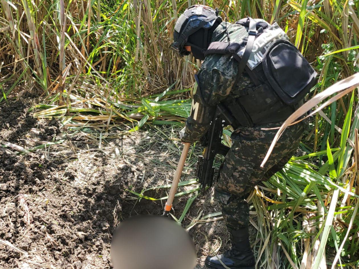 Hallan cuerpo semienterrado en una cañera de San Pedro Sula