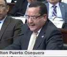 El diputado Milton Puerto da lectura al dictamen de la Ley de Justicia Energética durante el tercer y último debate en el Congreso Nacional.