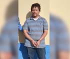 Momentos de la detención del hondureño tras arribar al aeropuerto Ramón Villeda Morales.