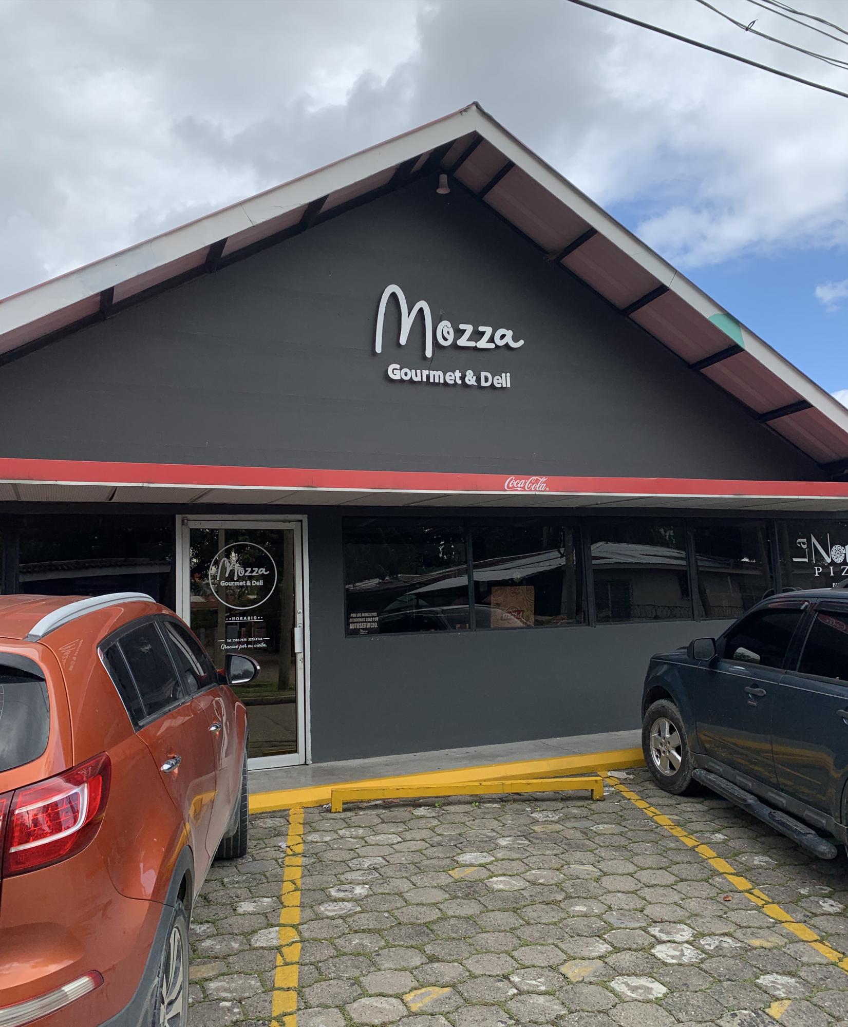 Mozza Gourmet está en Barrio Río de Piedras, 4 calle, 17 avenida, media cuadra abajo de Artisam.