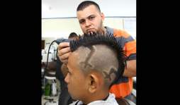 Diseñan hasta garrobos en cabezas de sus clientes