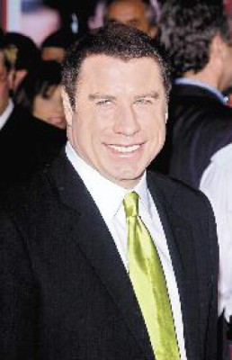 John Travolta, sorprendido besando a un 'amigo”